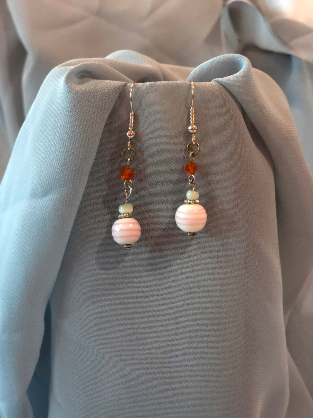 Pink and white dangle earrings