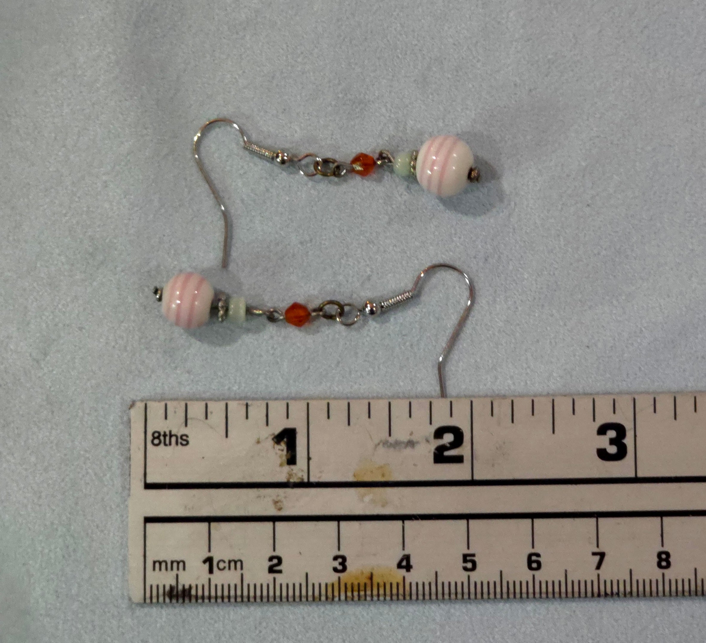 Pink and white dangle earrings